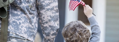 Military father with son and flag